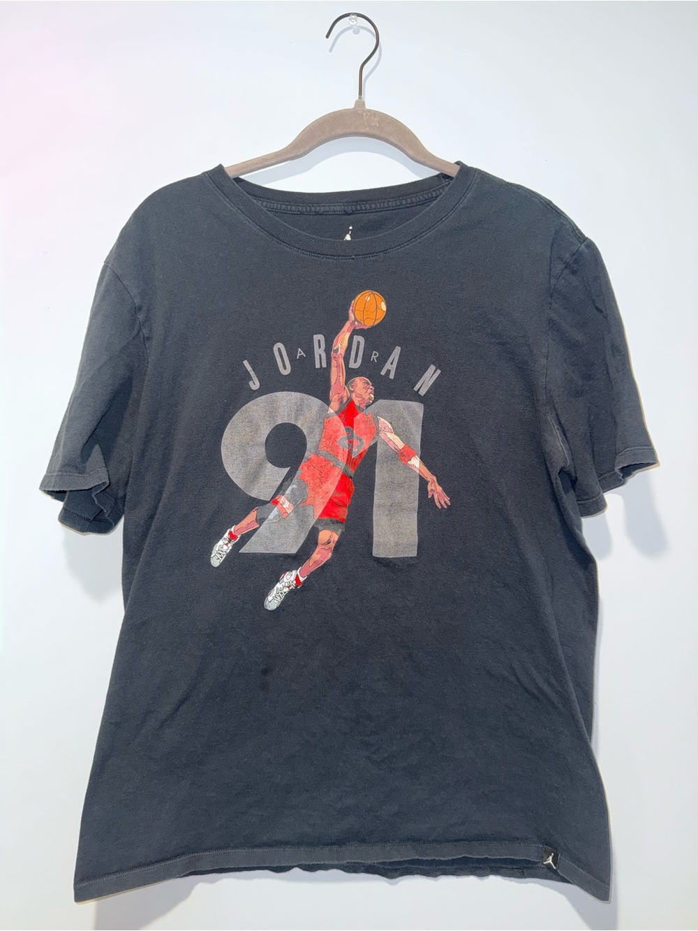 Jordan Black Tee with Orange Basketball Graphic and Red Accents